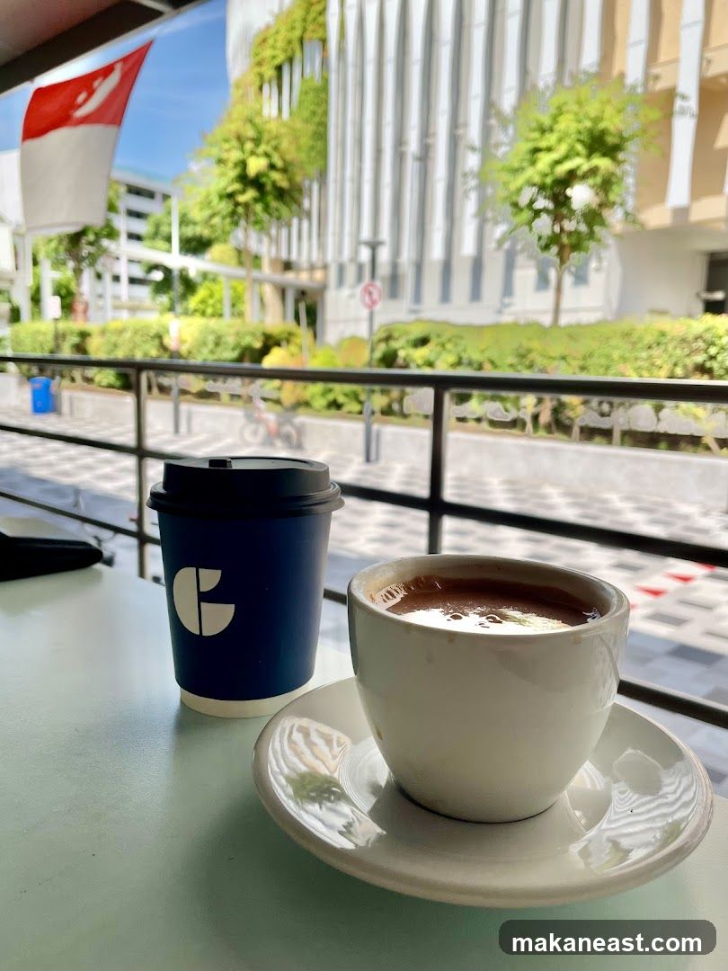 Coffee and a takeaway cup on a table