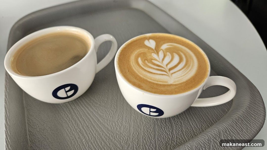 Two cups of coffee on a tray