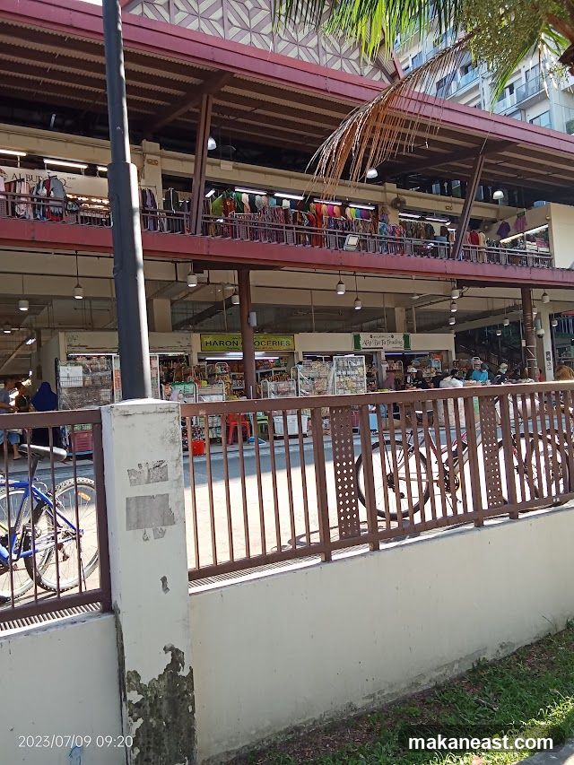 Market stalls with clothing and groceries