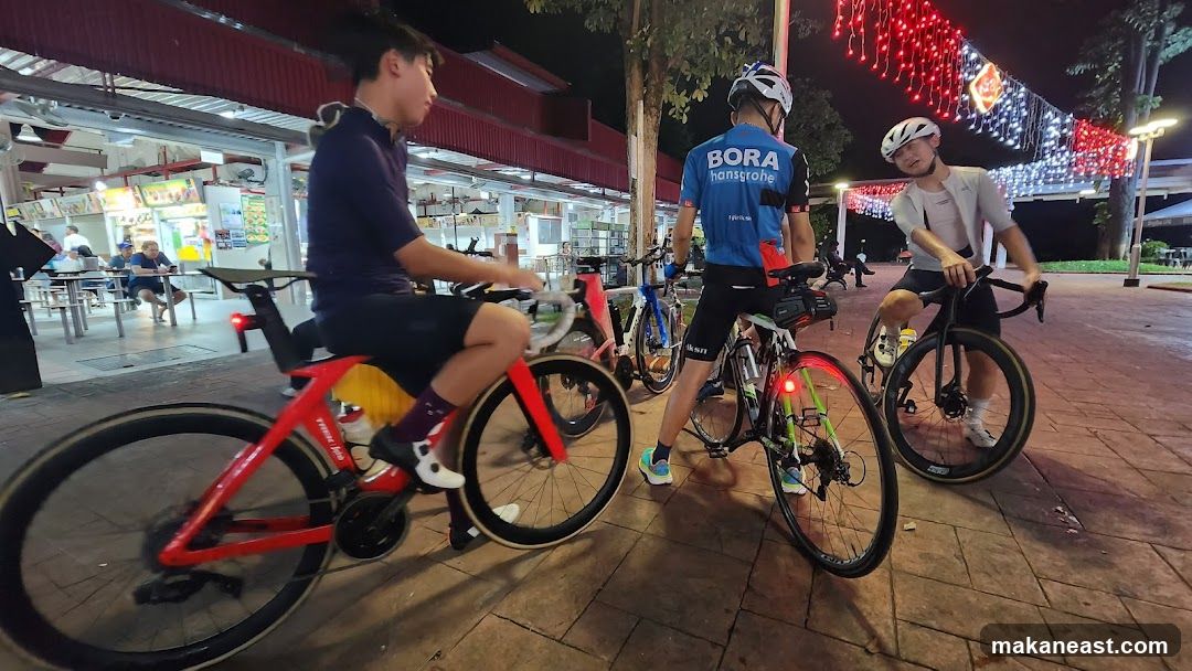 Cyclists at a food court