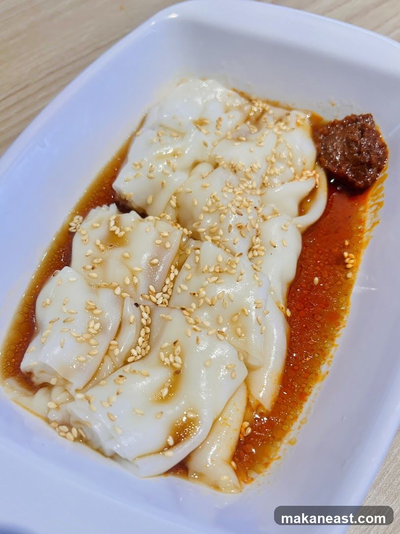 Steamed Rice Rolls with Sauce and Sesame Seeds