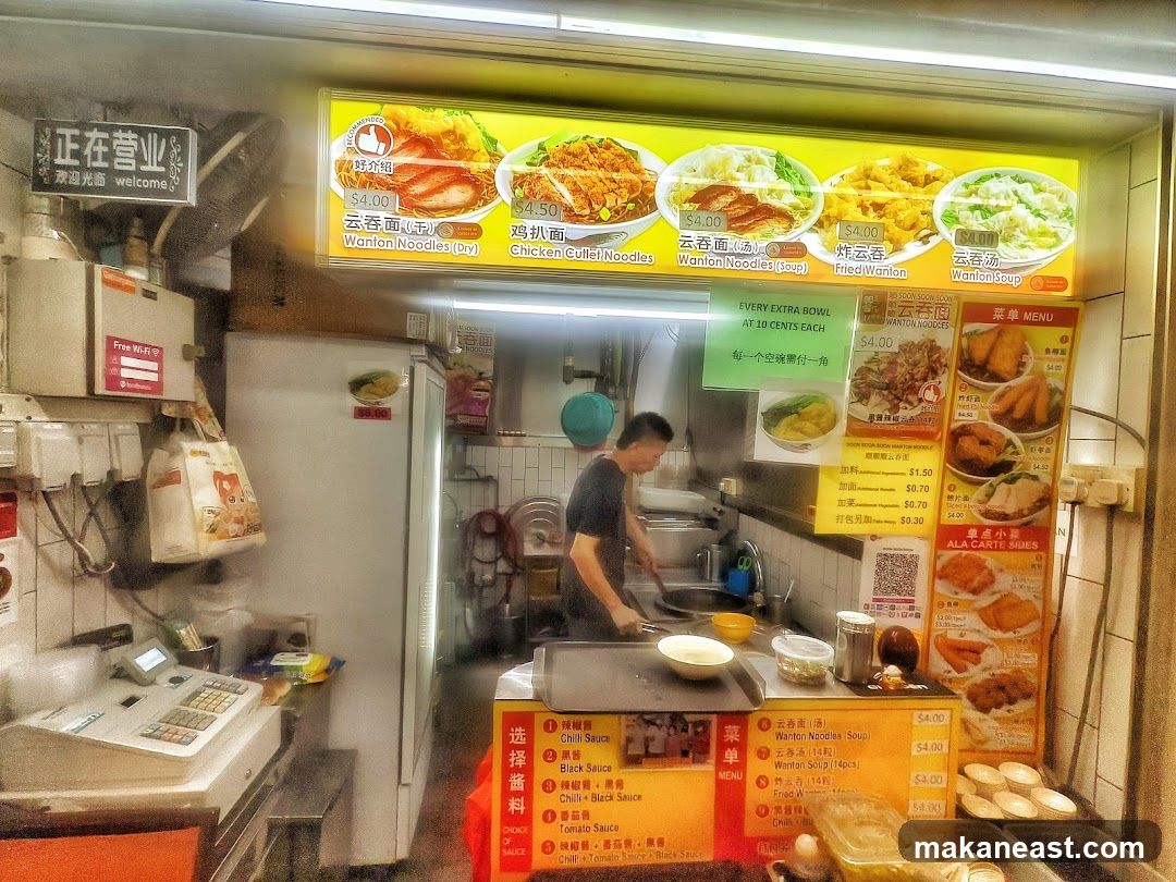 Food stall with menu and staff
