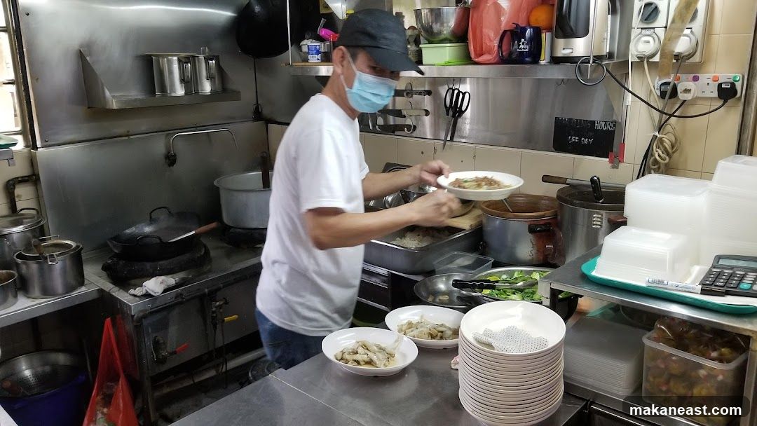 Cook preparing food in a kitchen