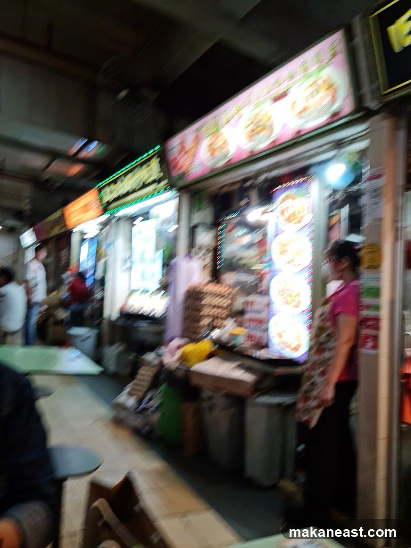 Food stalls with illuminated signs