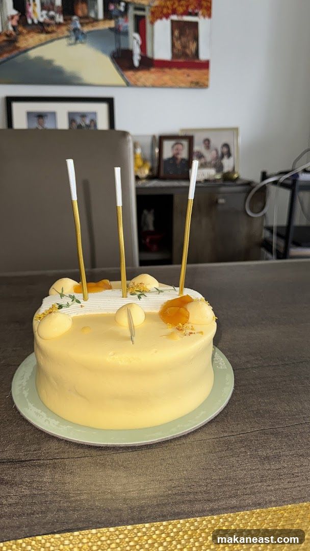 Yellow frosted cake with candles