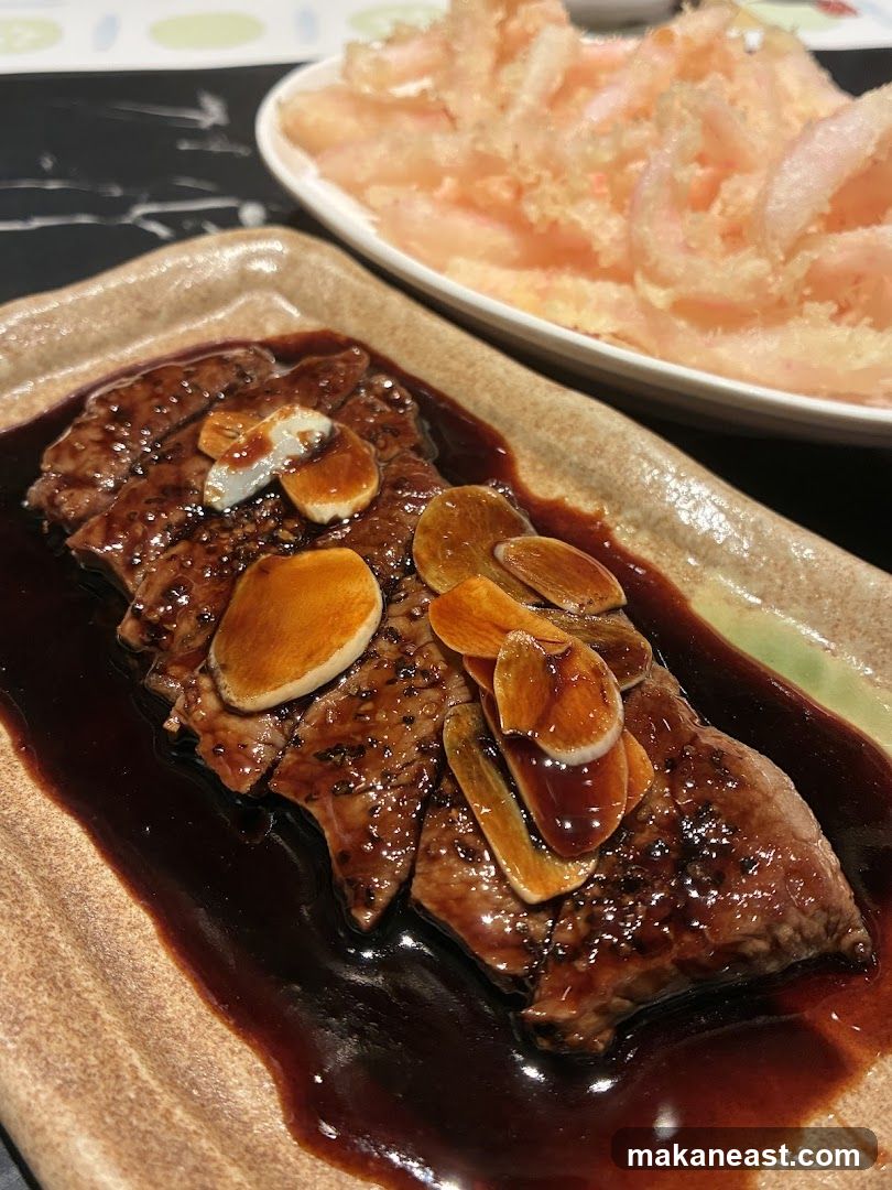 Sliced steak with garlic and sauce