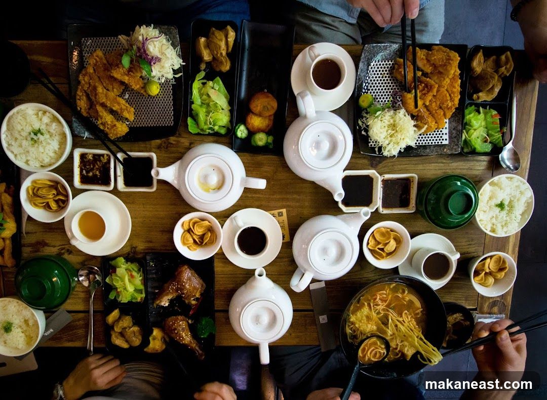 Overhead view of a table laden with Japanese food