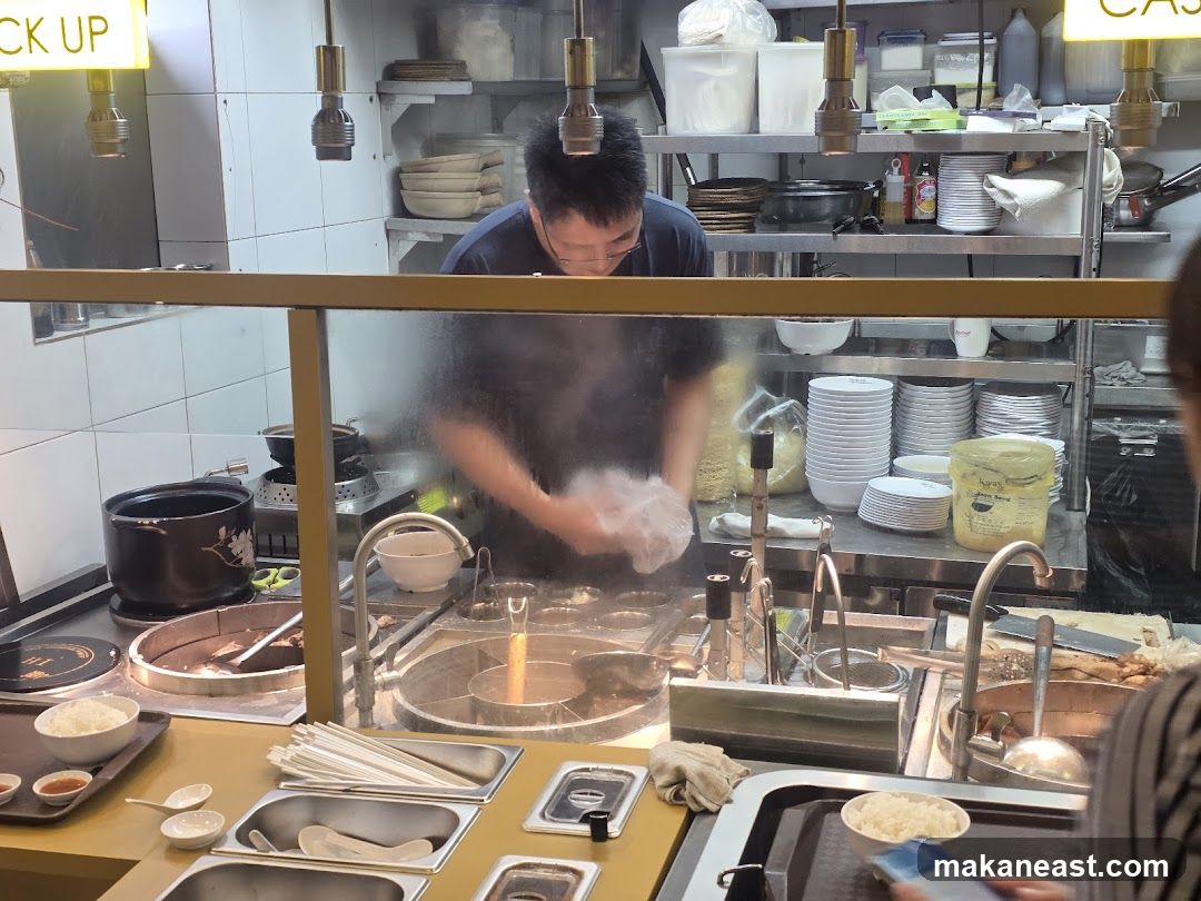 Kitchen counter with staff preparing food