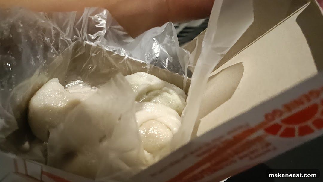 Steamed Dumplings in a Takeout Box