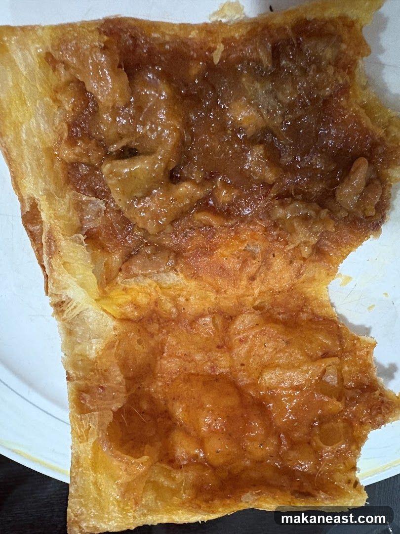 Close-up of a pastry with apple filling