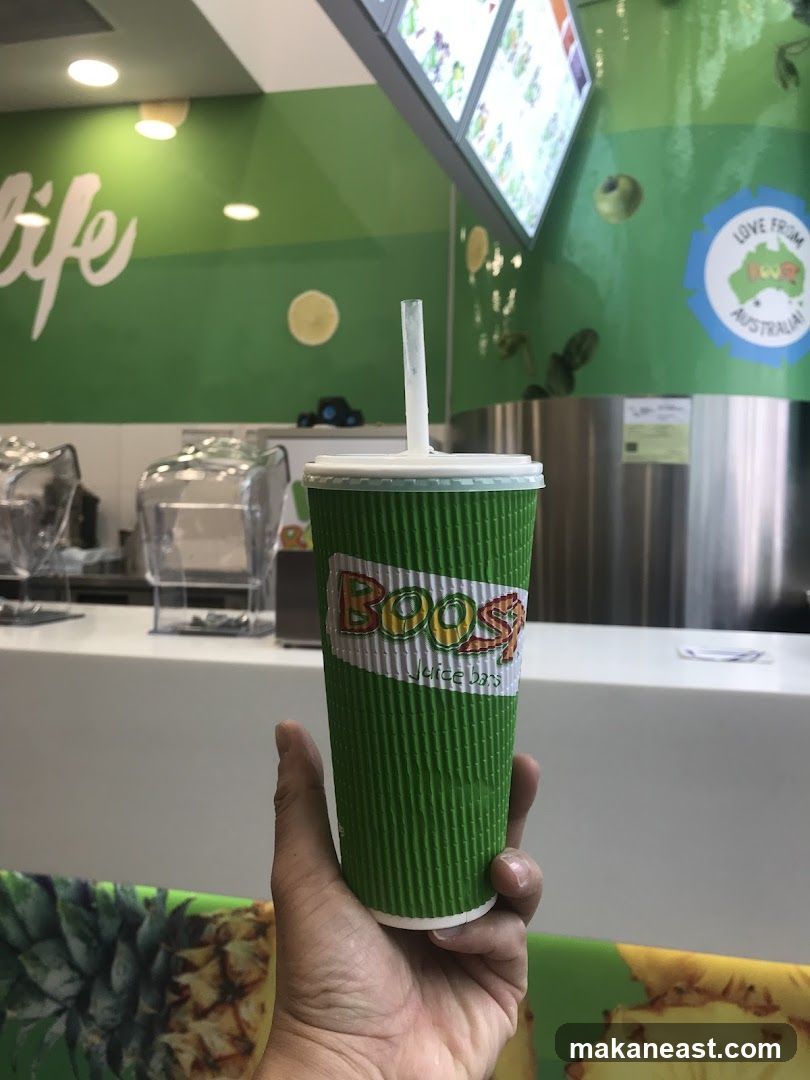 Hand holding a Boost Juice cup