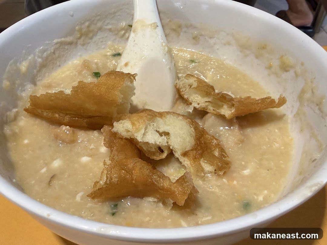 Bowl of Congee with Fried Dough Sticks
