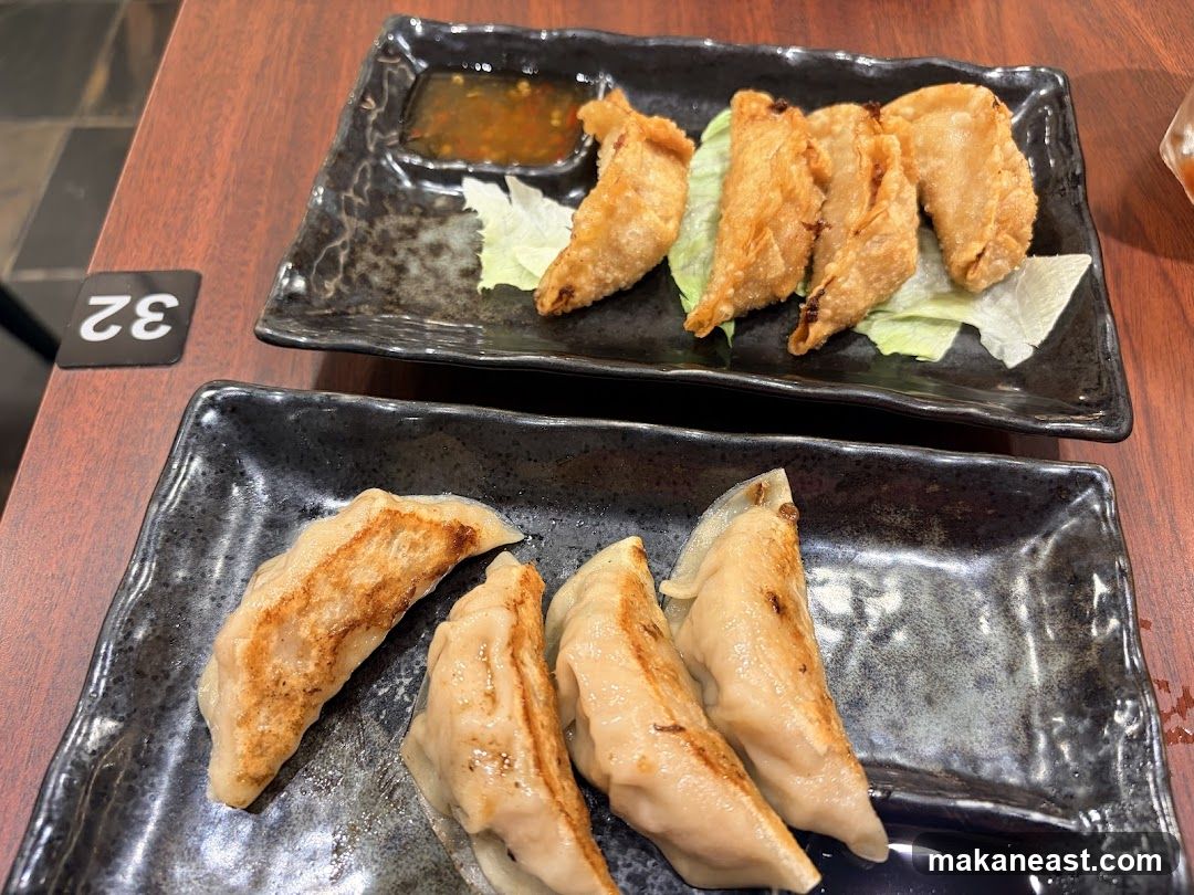 Two plates of dumplings