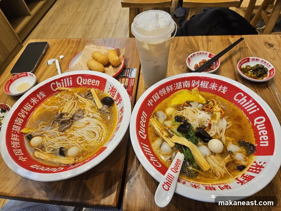 Two bowls of spicy rice noodles
