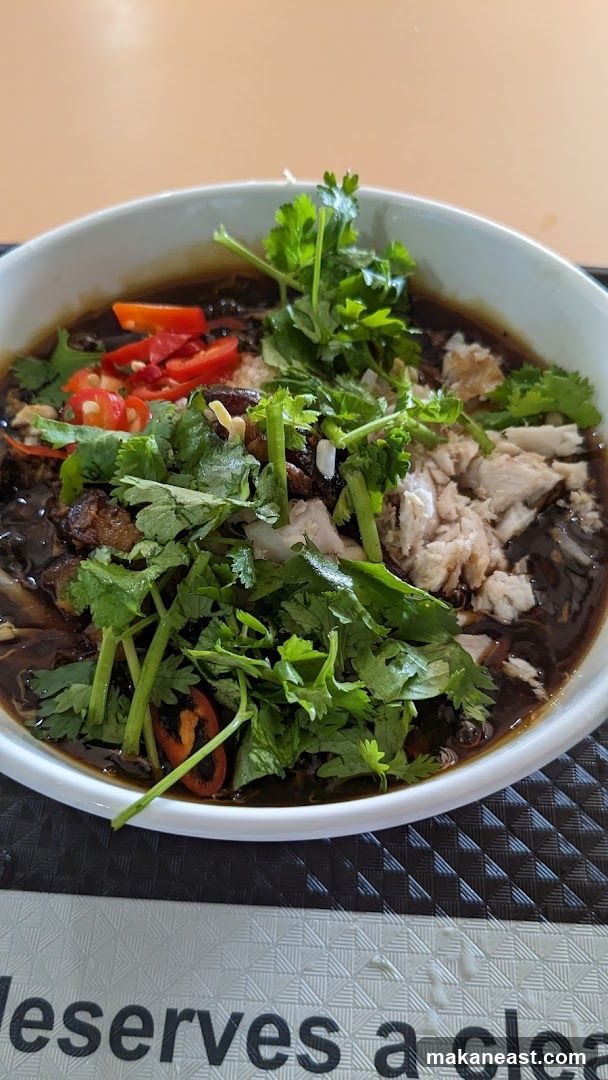 Bowl of noodles with shredded chicken and chili