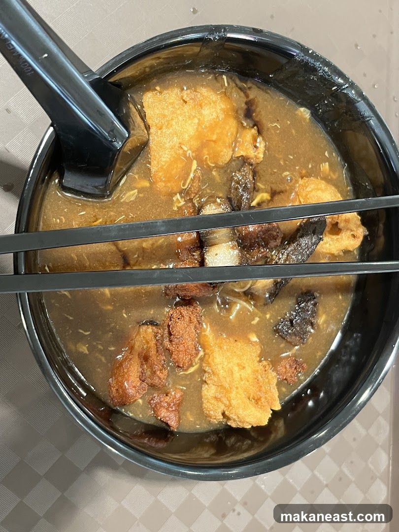 Bowl of Noodles with Fried Fish and Meat