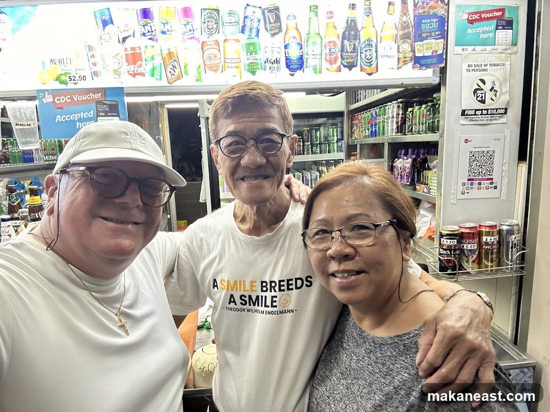 Three people in front of a store