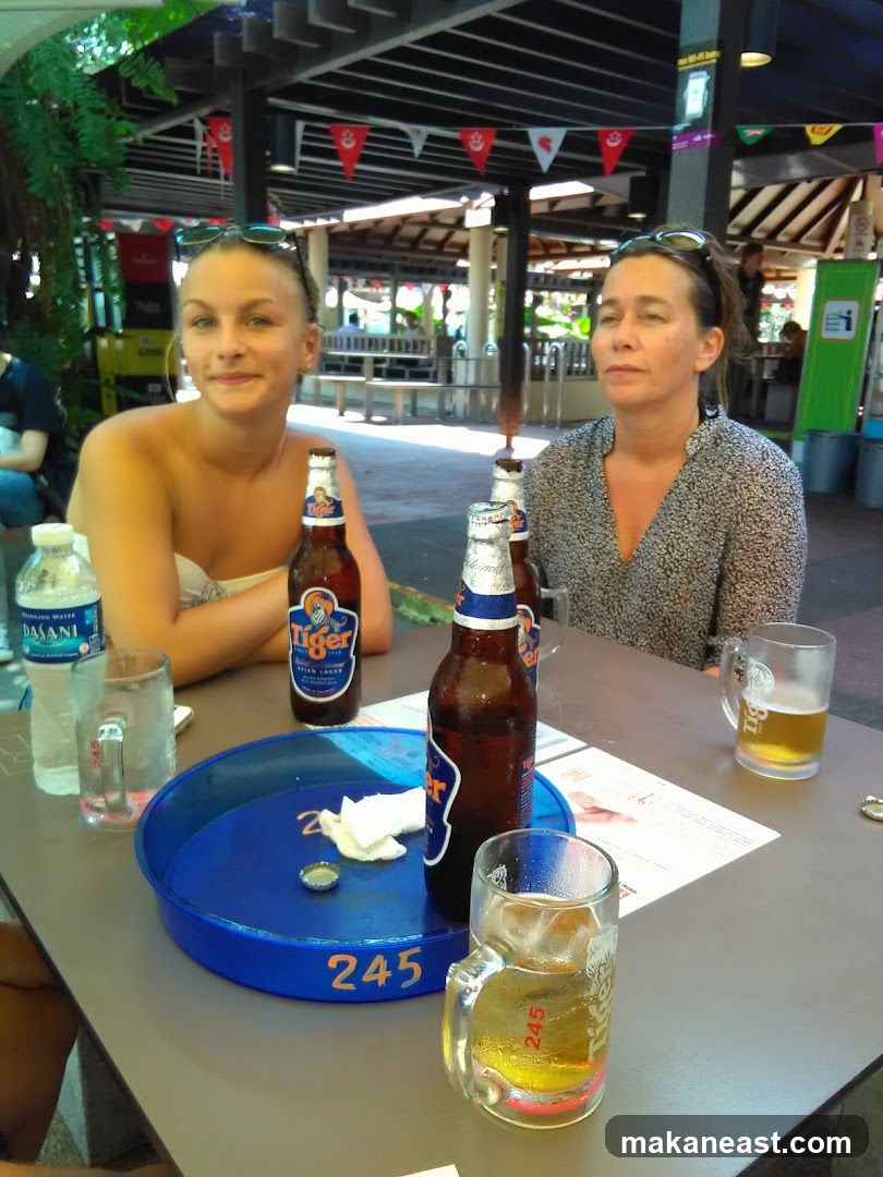 Two women sitting at a table with drinks