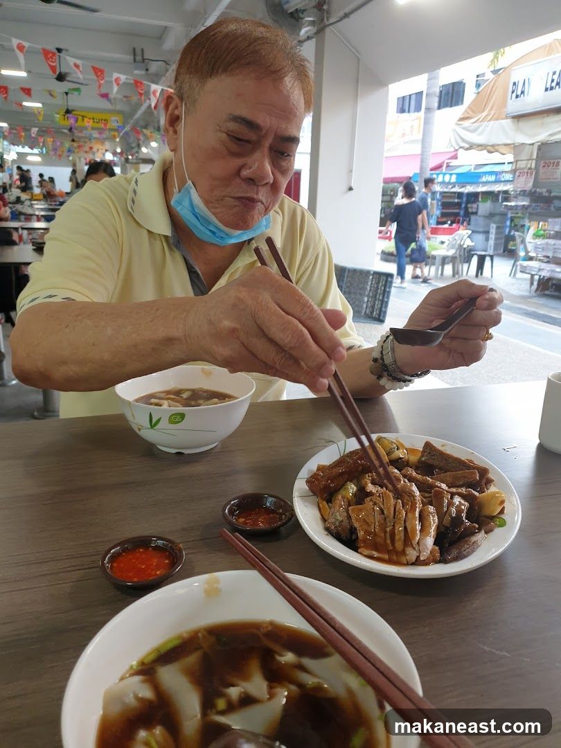 Man Eating Noodles