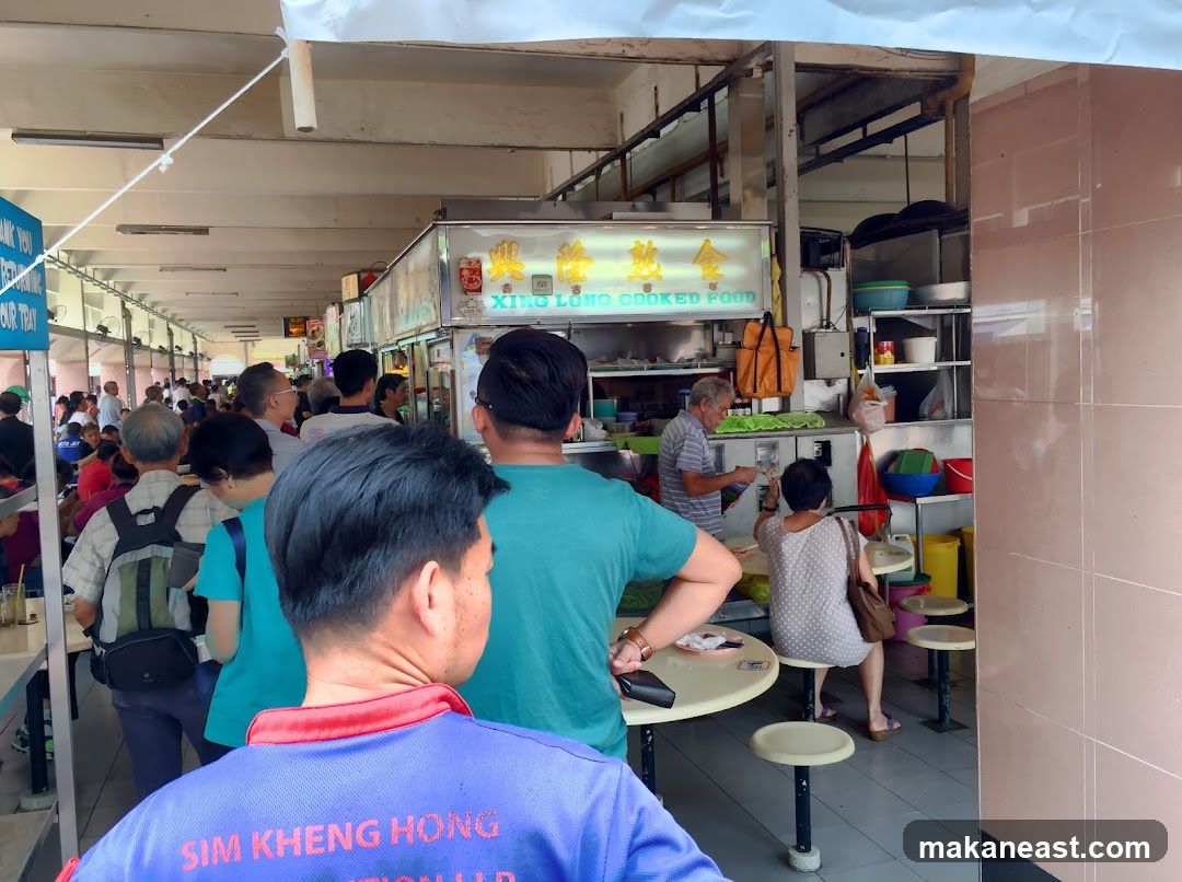 Busy Food Stall with Customers
