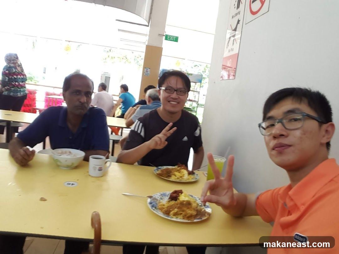 People eating at a hawker centre