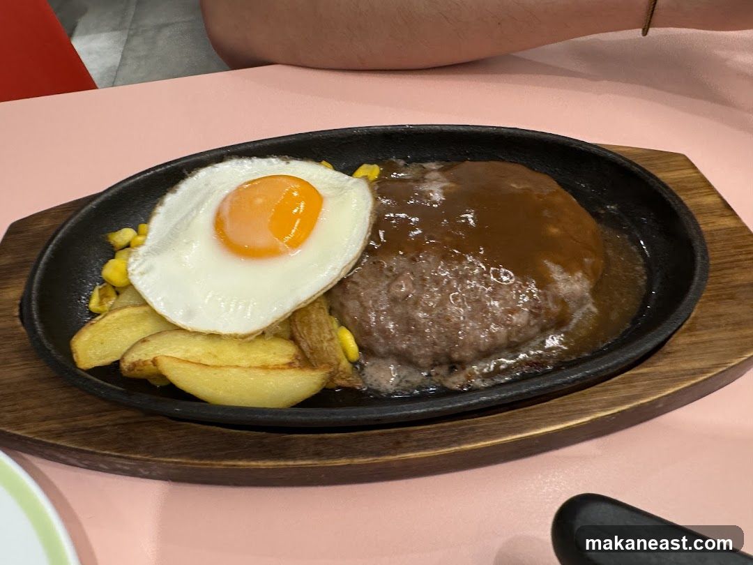 Hamburger steak with fried egg and potatoes