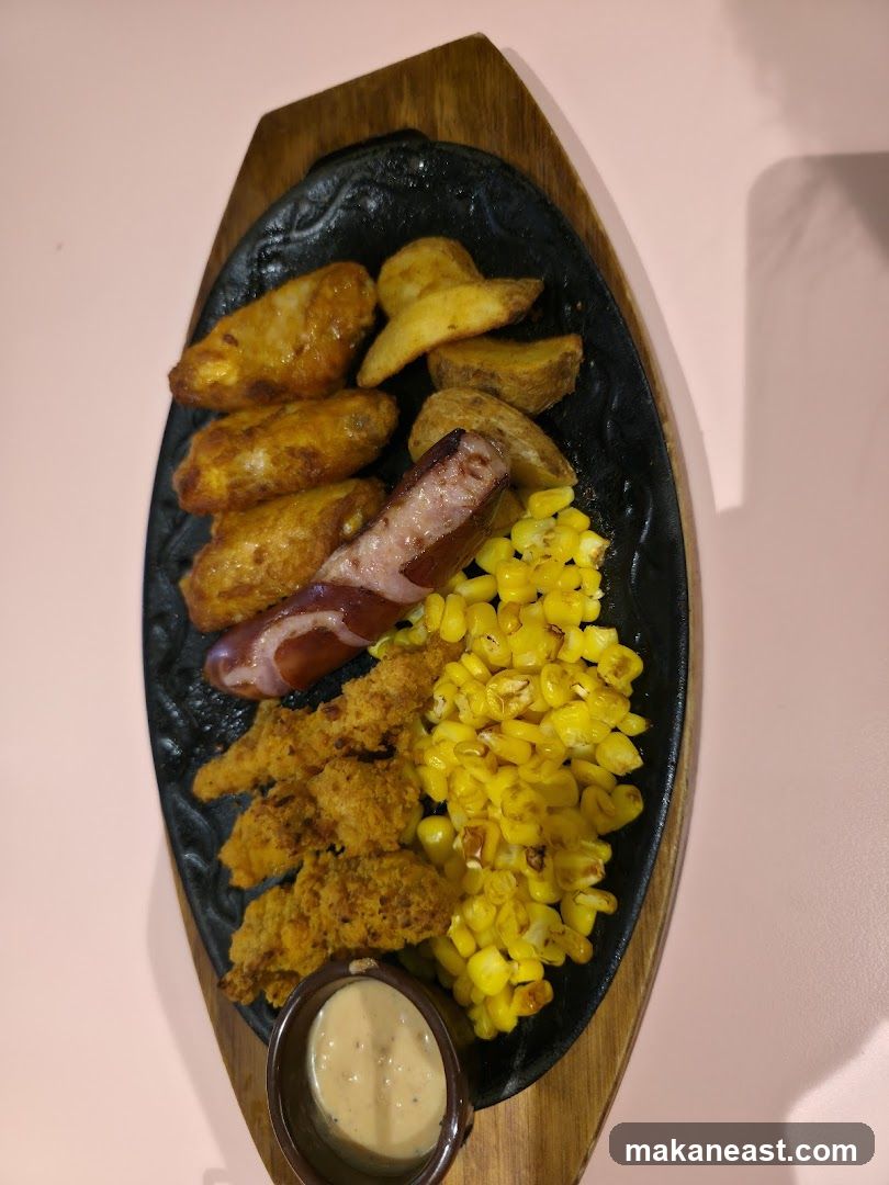 Sizzling Platter with Chicken Wings, Sausage, and Corn