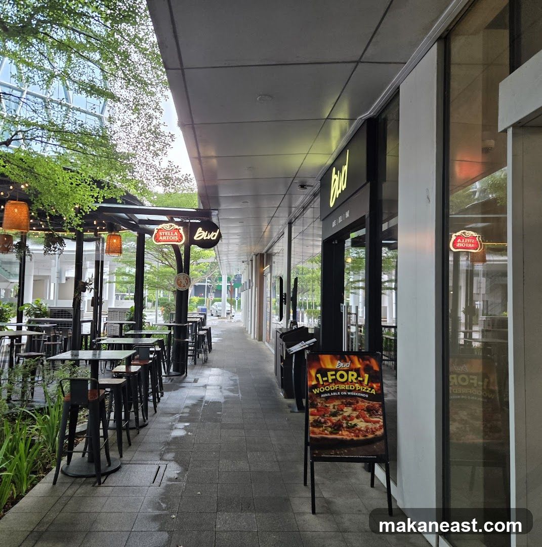Bud Cafe Exterior with Pizza Promotion