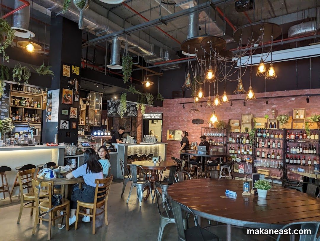 Interior of a restaurant with brick walls and hanging lights