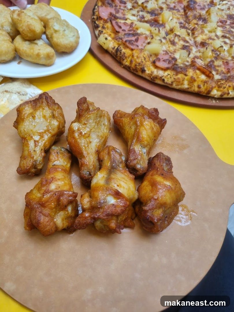 Chicken wings, nuggets, and pizza