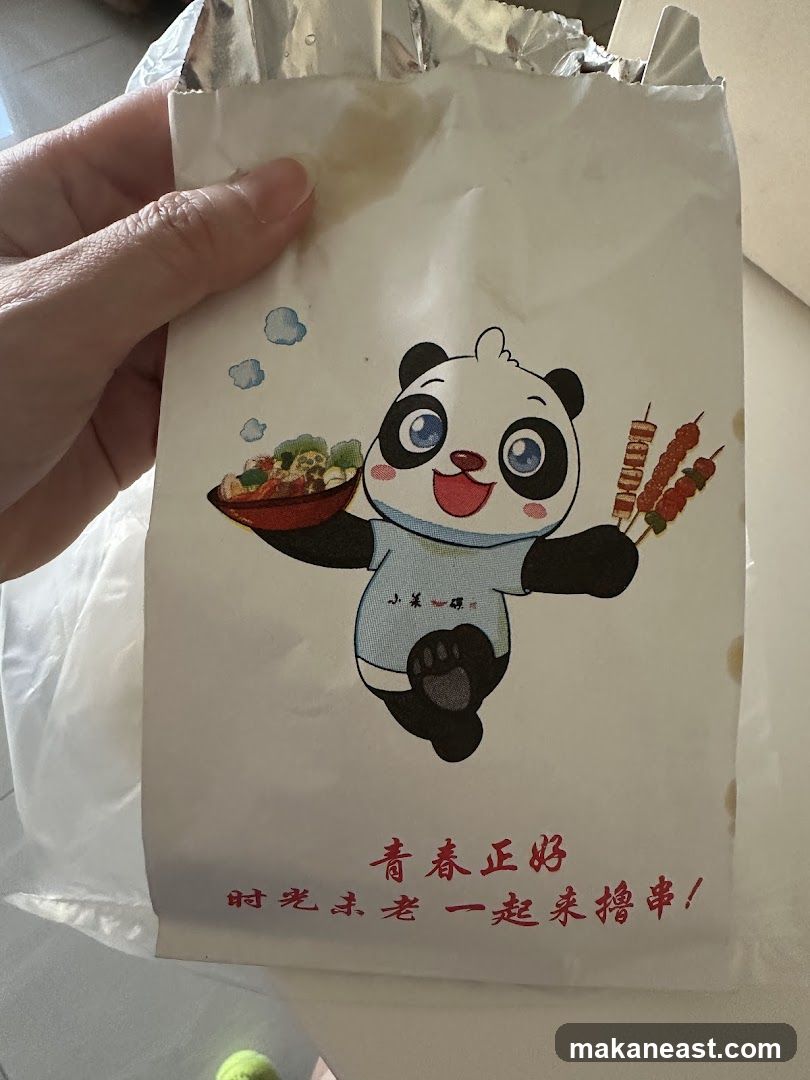 Paper bag with panda illustration