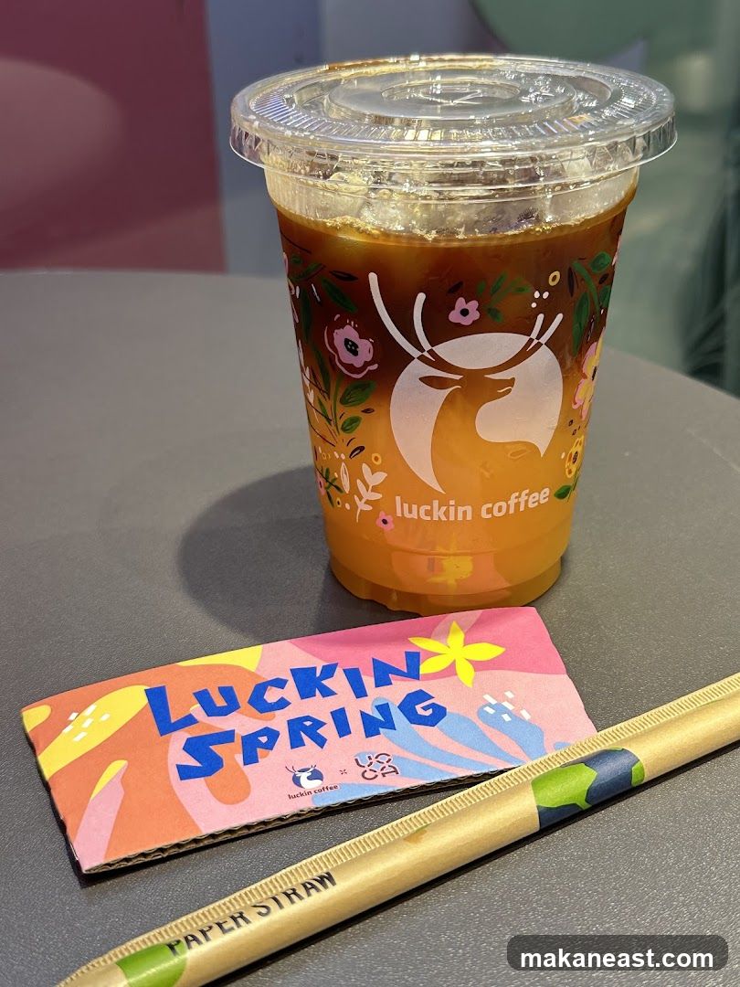 Luckin Coffee Drink with Spring Themed Sleeve and Straw