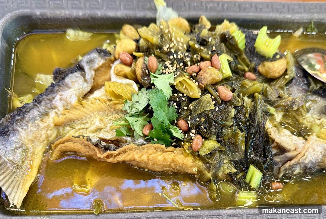 Fish dish with pickled vegetables and peanuts