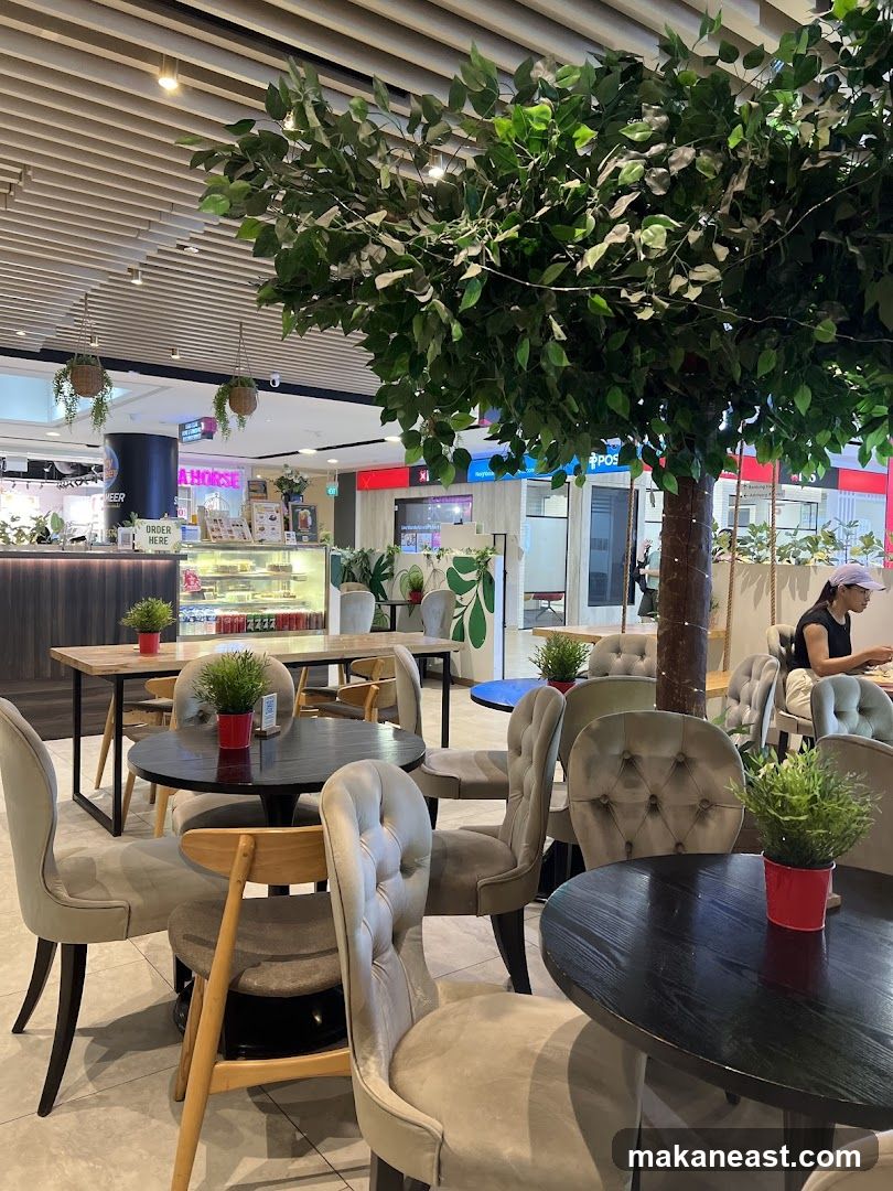 Cafe Interior with Seating and Artificial Tree