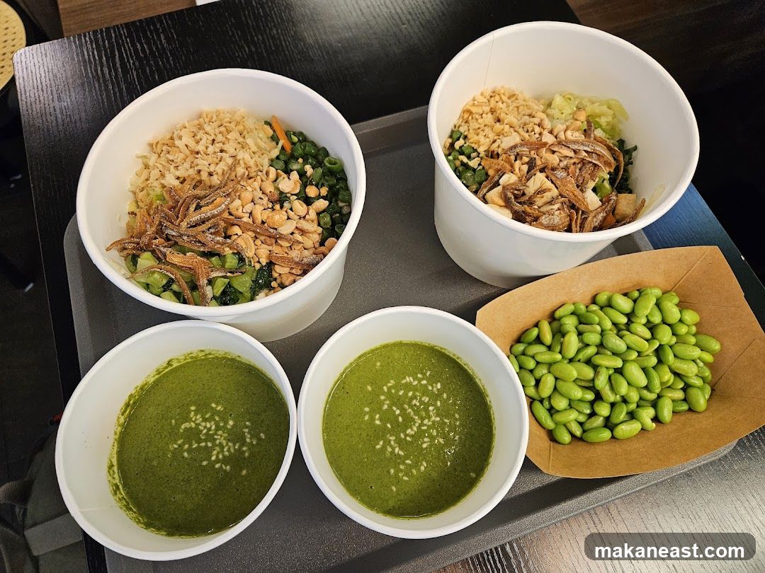 Two bowls of rice with toppings and two bowls of soup