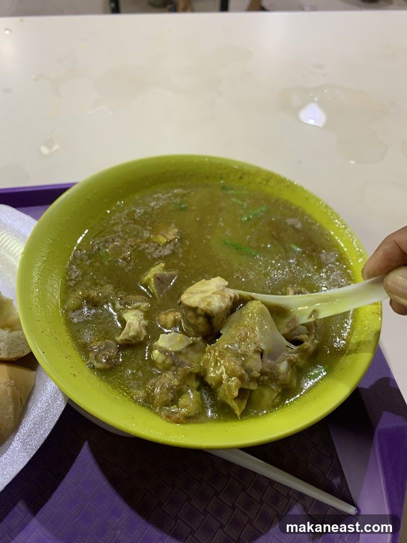Bowl of Stew with Meat and Bread