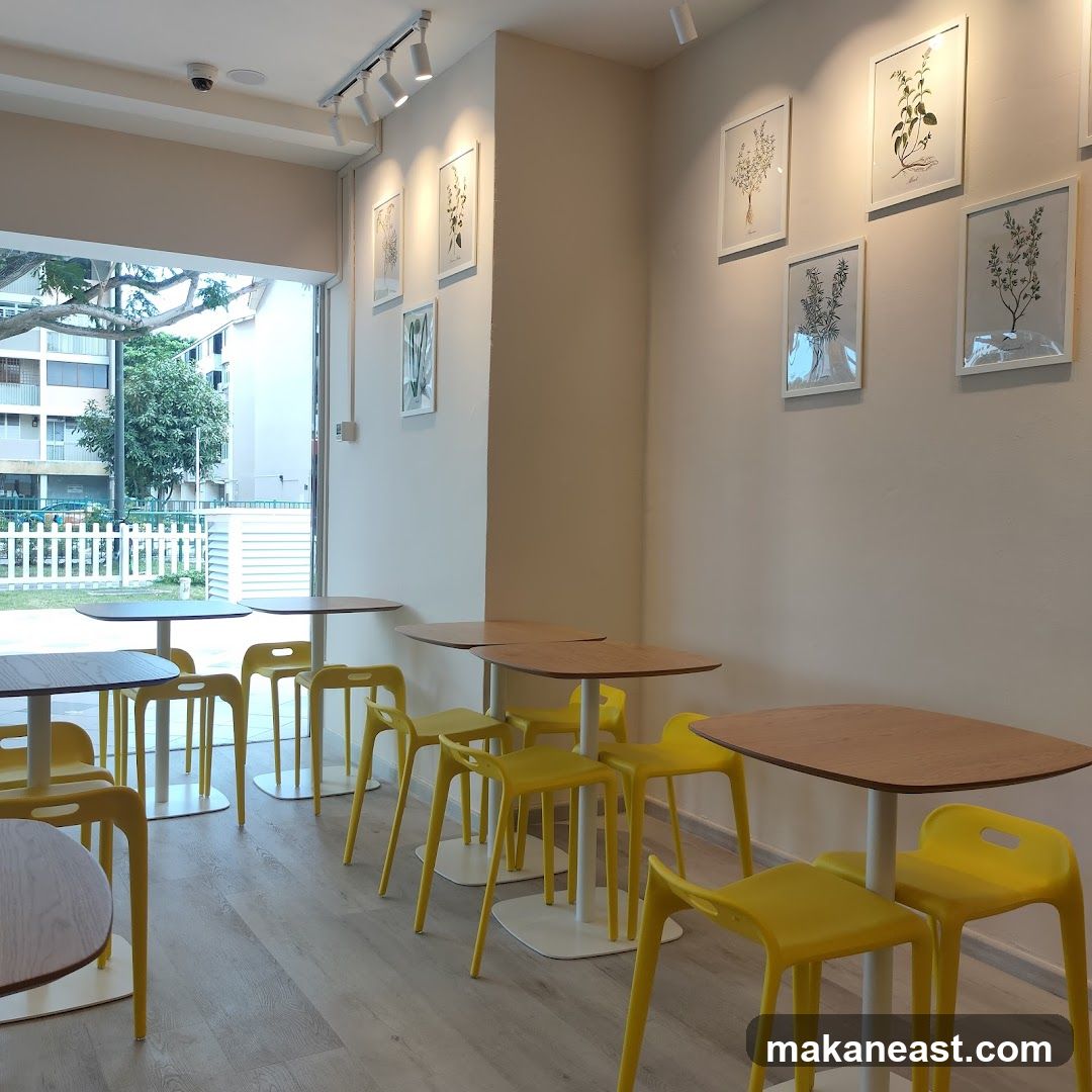 Cafe Interior with Yellow Chairs and Botanical Art