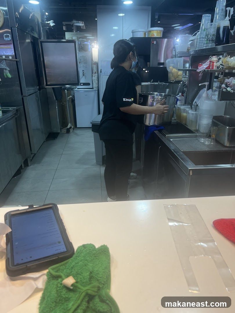 Staff preparing drinks in a kitchen