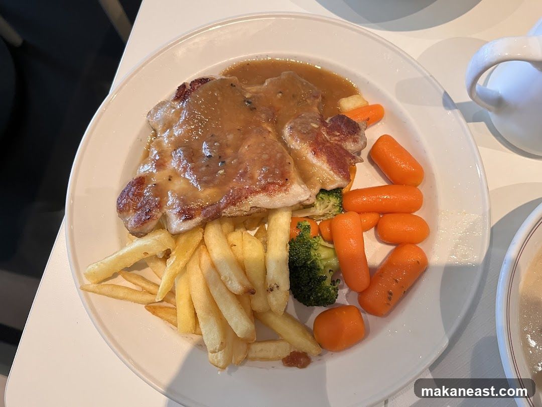 Chicken dish with fries and vegetables