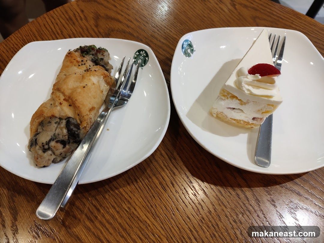 Two plates with pastries and forks