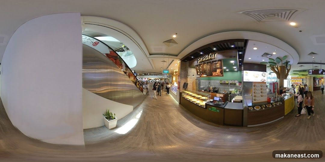 Food court stall with pizzas and menu