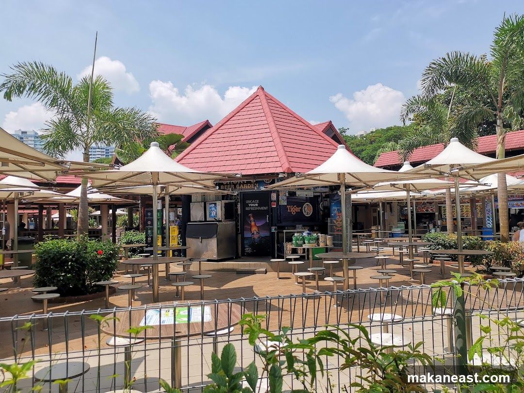Outdoor seating area with food stalls