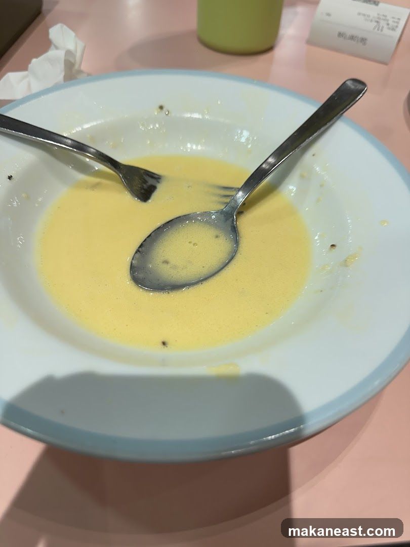 Partially Eaten Dish with Utensils