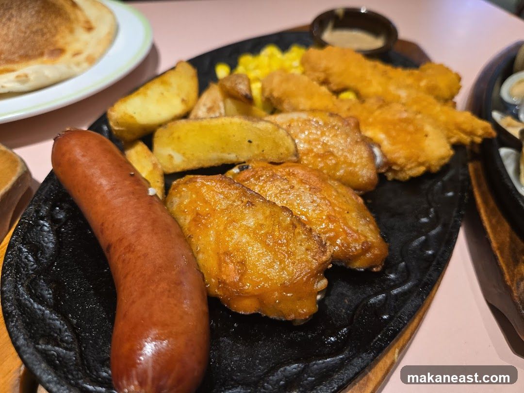 Sizzling Platter with Sausage, Wings, and Fries