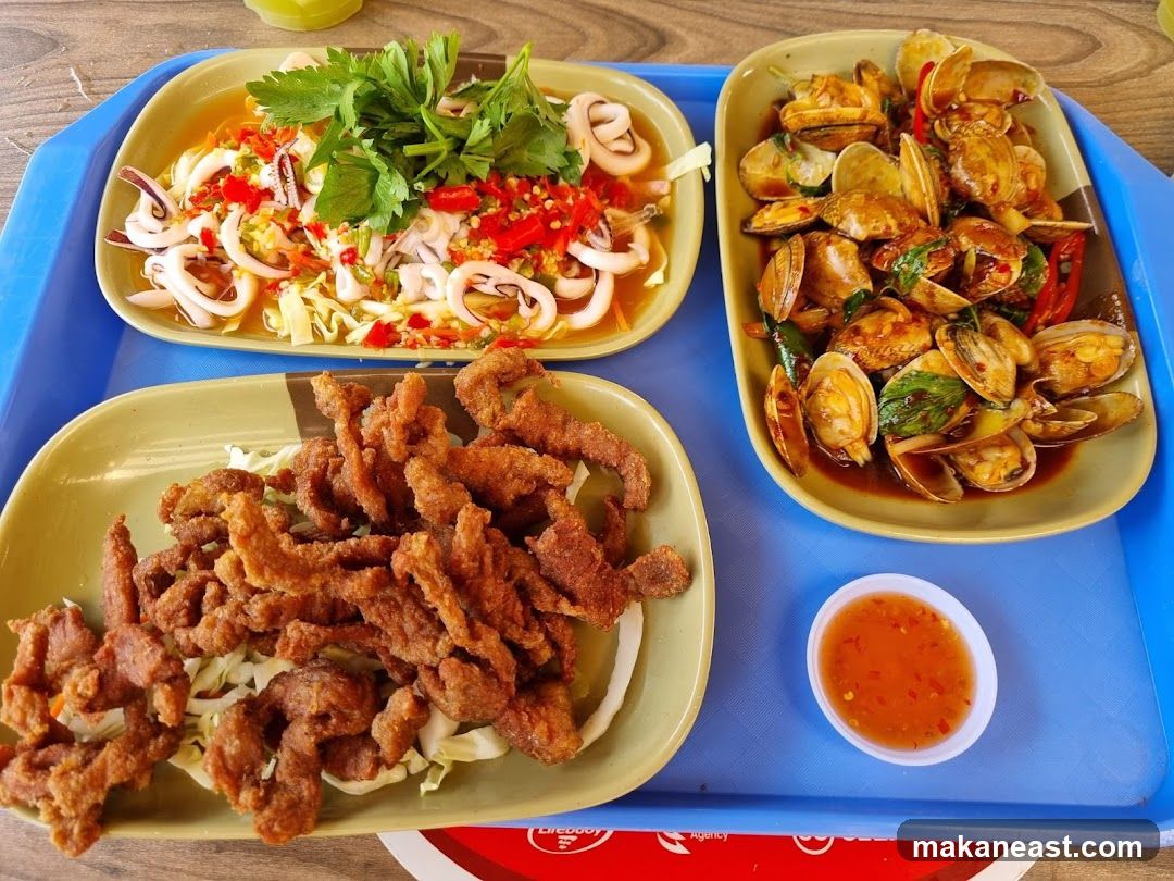 Three dishes of food on a tray
