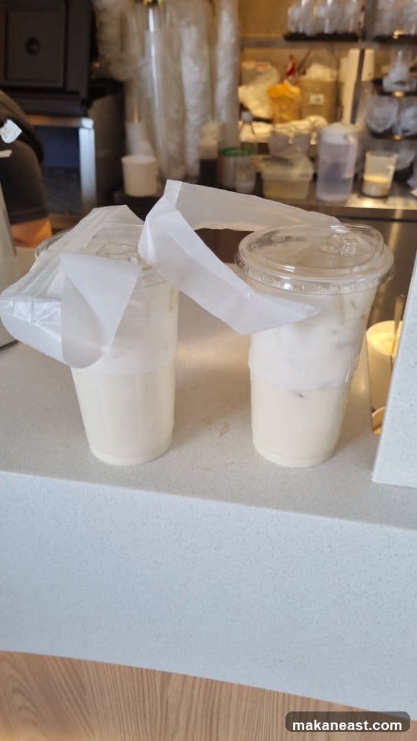 Two creamy drinks with foam