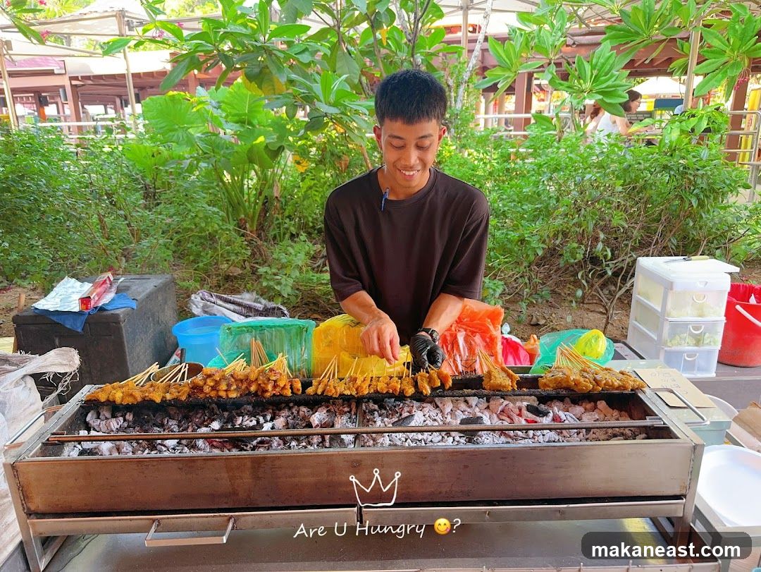 Man grilling satay