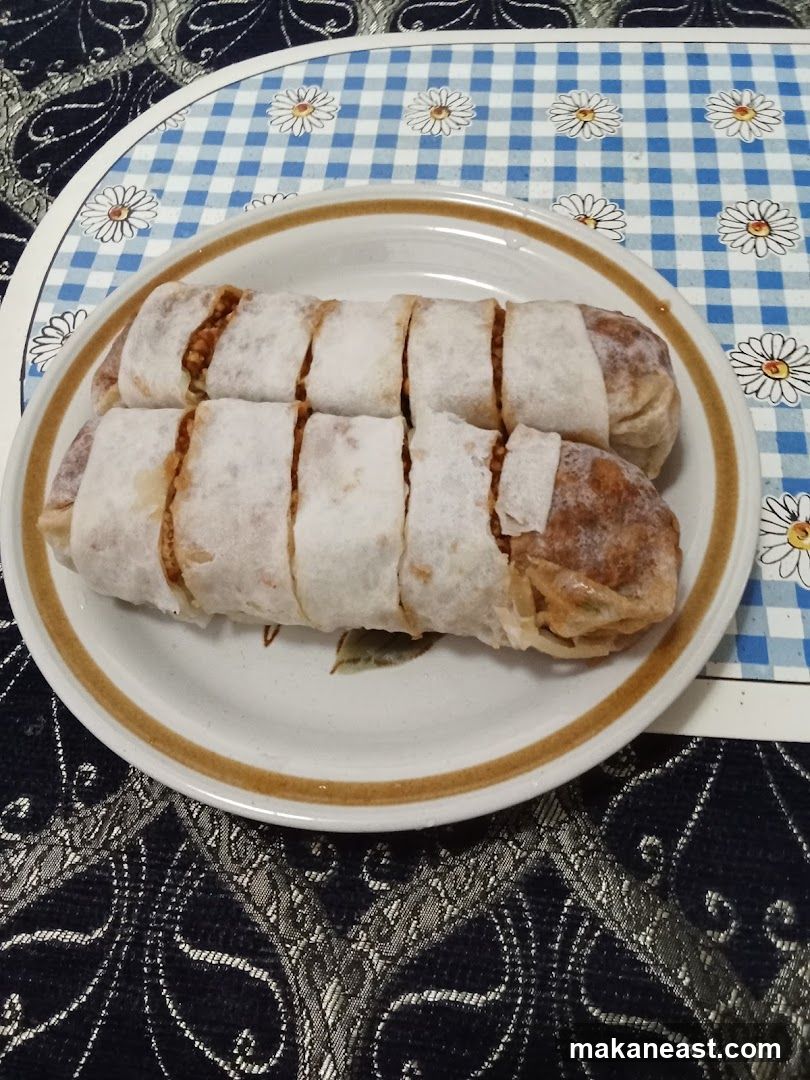 Two apple strudels on a plate