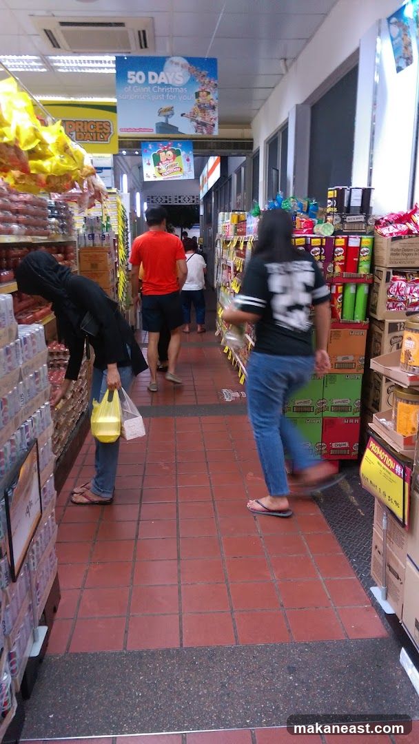 Supermarket aisle with shoppers
