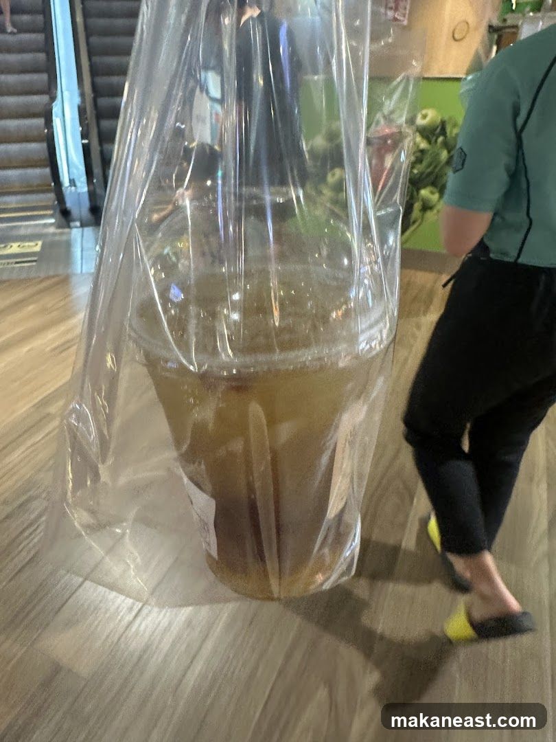 Person carrying a large drink